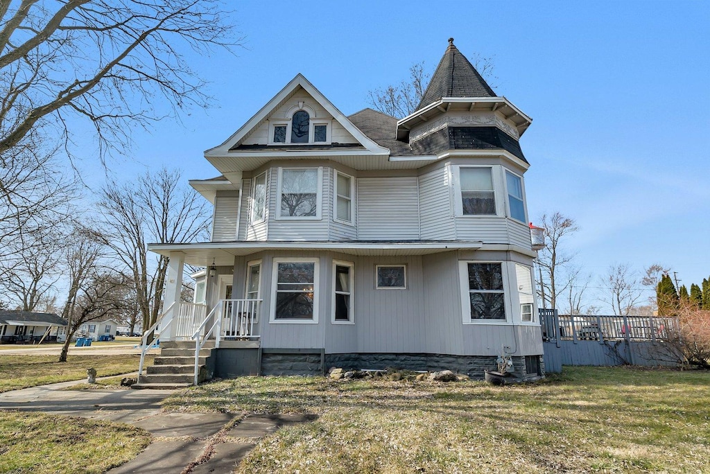 401 7th St, Mazon, IL 60444 - victorian-style house featuring covered porch and a front lawn