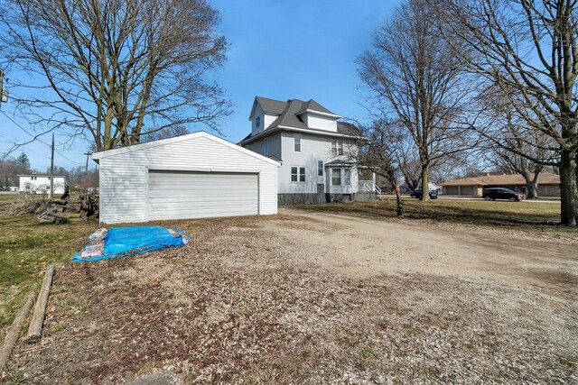401 7th St, Mazon, IL 60444 - view of property exterior featuring an outbuilding and a detached garage