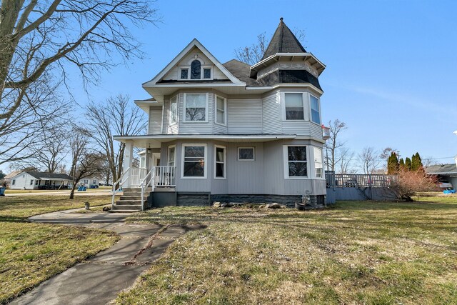 401 7th St, Mazon, IL 60444 - victorian house featuring covered porch and a front lawn