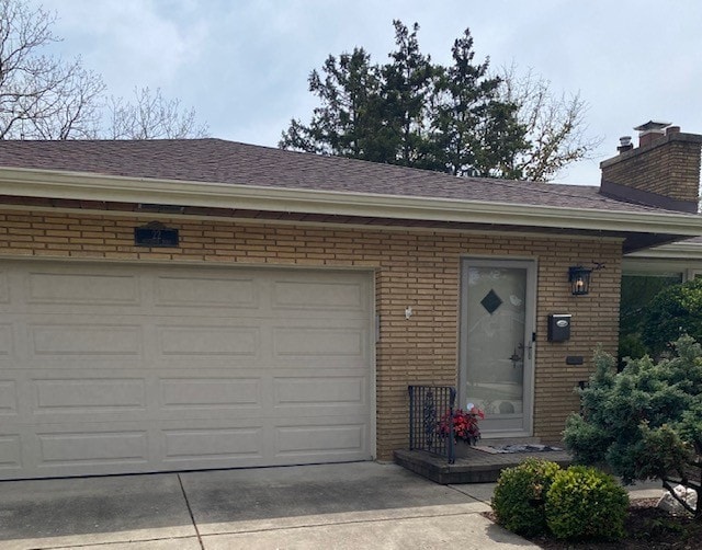 garage featuring driveway