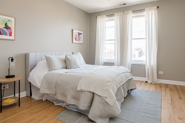 612 S Western Ave Unit 3, Chicago, IL 60612 - bedroom featuring baseboards, visible vents, and light wood-style floors