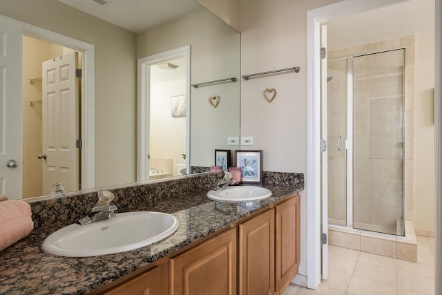 612 S Western Ave Unit 3, Chicago, IL 60612 - bathroom featuring a sink, tile patterned flooring, and a shower stall