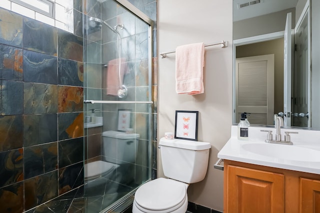 612 S Western Ave Unit 3, Chicago, IL 60612 - full bathroom featuring vanity, visible vents, toilet, and a shower stall
