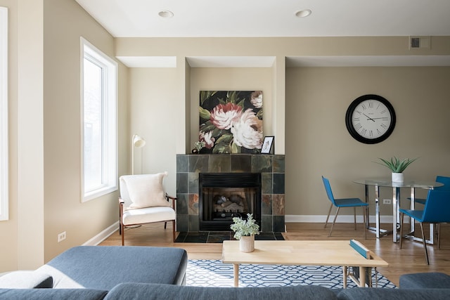 612 S Western Ave Unit 3, Chicago, IL 60612 - living area with a fireplace, recessed lighting, baseboards, wood finished floors, and visible vents