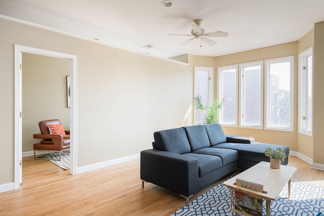 612 S Western Ave Unit 3, Chicago, IL 60612 - living room with ceiling fan, visible vents, baseboards, and light wood finished floors