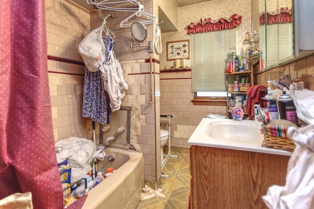 bathroom with vanity, tile walls, toilet, and tile patterned floors