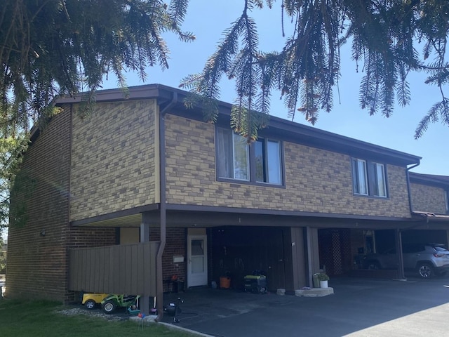 view of side of property with brick siding