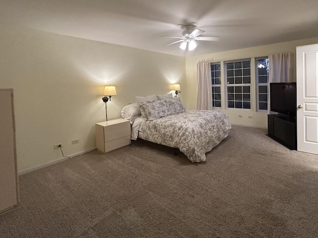 bedroom with carpet floors, baseboards, and ceiling fan