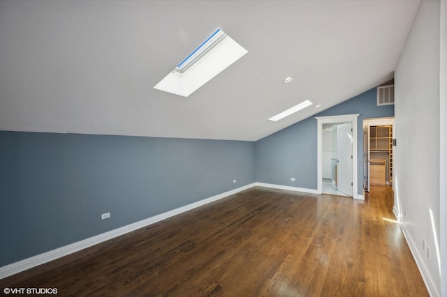 3755 N Wilton Ave Unit 3Se, Chicago, IL 60613 - bonus room featuring vaulted ceiling with skylight, baseboards, wood finished floors, and visible vents