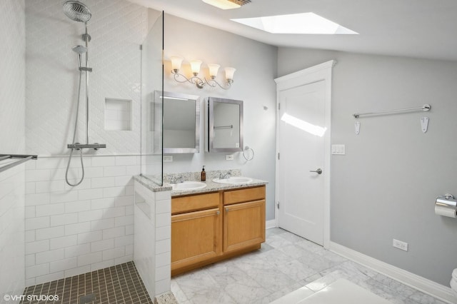 3755 N Wilton Ave Unit 3Se, Chicago, IL 60613 - full bathroom featuring double vanity, walk in shower, a sink, and lofted ceiling with skylight
