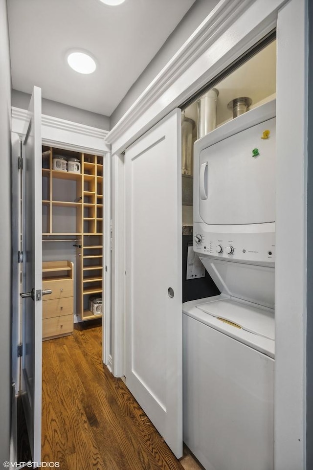 3755 N Wilton Ave Unit 3Se, Chicago, IL 60613 - laundry area featuring stacked washer / drying machine, dark wood finished floors, and laundry area