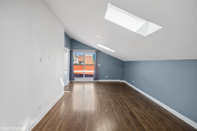 3755 N Wilton Ave Unit 3Se, Chicago, IL 60613 - bonus room featuring vaulted ceiling with skylight, baseboards, and dark wood-style flooring