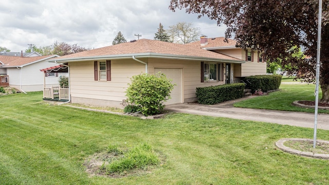 view of property exterior with a lawn, an attached garage, a chimney, and roof with shingles