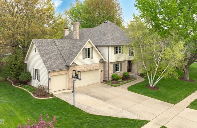 view of front of property featuring a chimney, a shingled roof, a front yard, and concrete driveway
