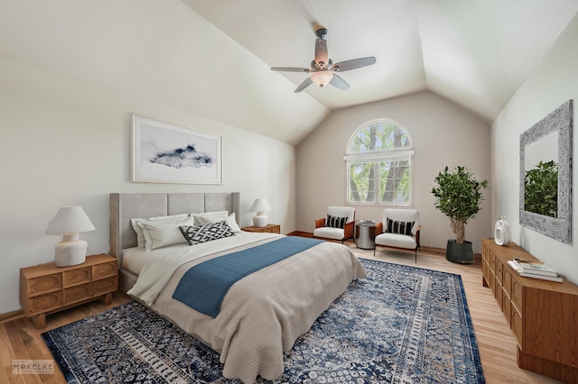 bedroom featuring ceiling fan, vaulted ceiling, and wood finished floors