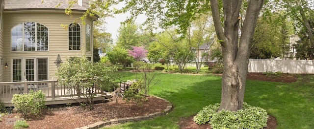 view of yard featuring a deck and fence