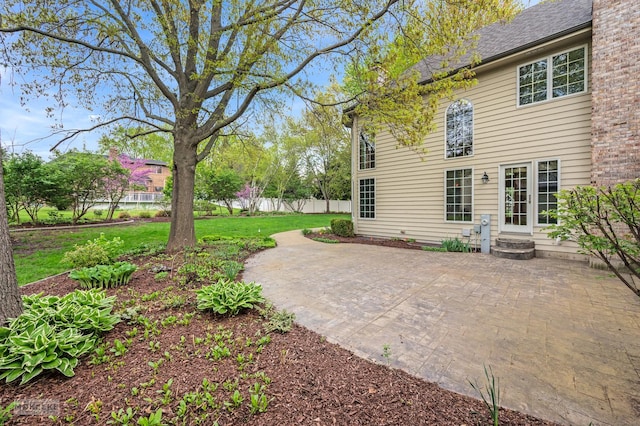 view of yard featuring a patio and fence
