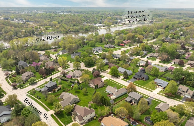 aerial view featuring a water view, a residential view, and a forest view