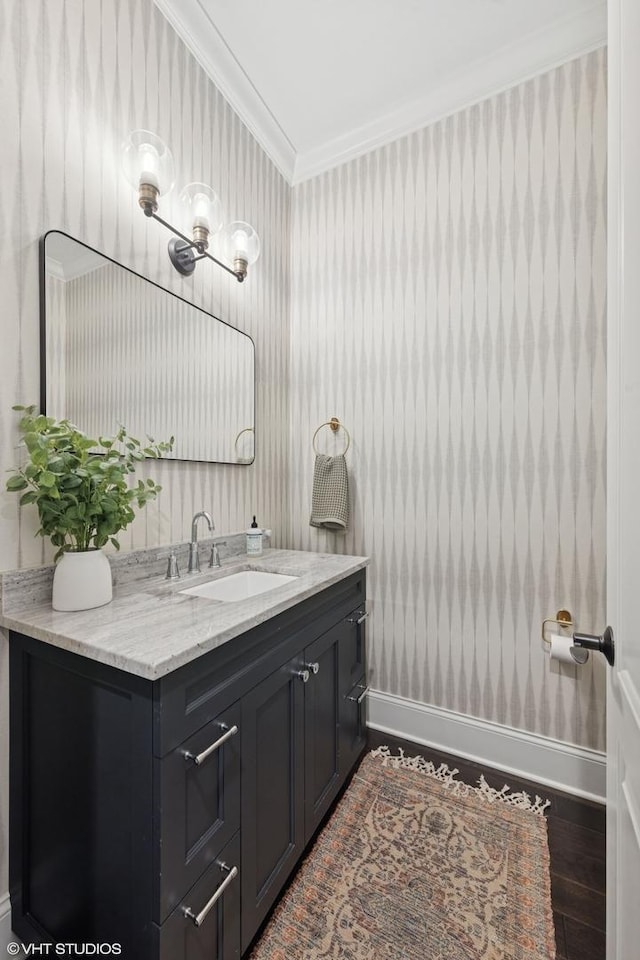 311 E Schiller St, Elmhurst, IL 60126 - bathroom with crown molding, vanity, wood finished floors, baseboards, and a chandelier