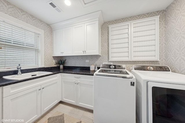 311 E Schiller St, Elmhurst, IL 60126 - laundry room featuring washer and dryer, wallpapered walls, and cabinet space
