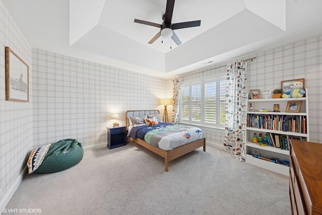 311 E Schiller St, Elmhurst, IL 60126 - carpeted bedroom featuring wallpapered walls, a tray ceiling, and a ceiling fan