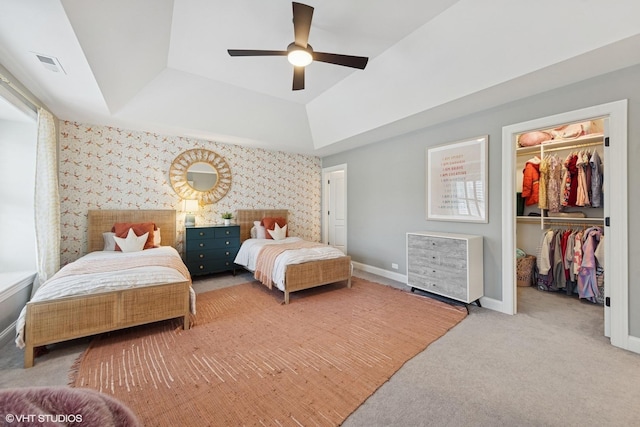 311 E Schiller St, Elmhurst, IL 60126 - bedroom with a raised ceiling, a walk in closet, carpet floors, a closet, and wallpapered walls