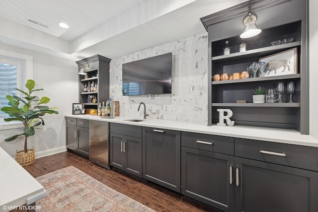 311 E Schiller St, Elmhurst, IL 60126 - indoor wet bar featuring fridge, dark wood finished floors, baseboards, and built in shelves