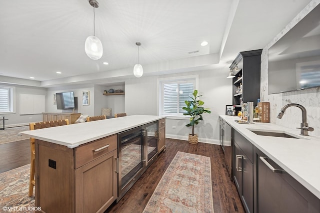 311 E Schiller St, Elmhurst, IL 60126 - kitchen with a sink, open shelves, wine cooler, baseboards, and light countertops