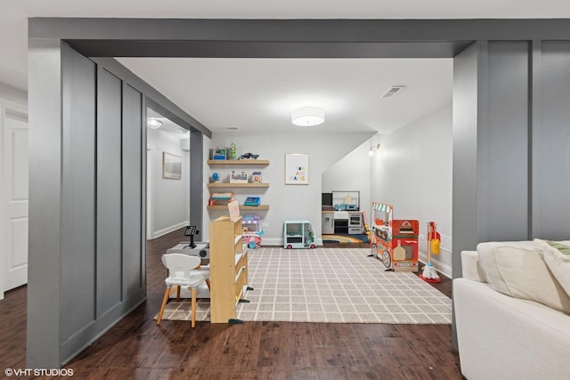 311 E Schiller St, Elmhurst, IL 60126 - game room featuring dark wood-style floors and baseboards