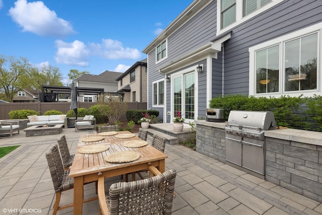 311 E Schiller St, Elmhurst, IL 60126 - view of patio featuring a fire pit, area for grilling, fence, and outdoor dining area
