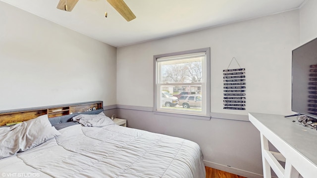 2818 Brentwood Dr, Racine, WI 53403 - bedroom featuring wood finished floors, baseboards, and a ceiling fan