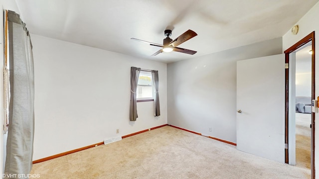 2818 Brentwood Dr, Racine, WI 53403 - unfurnished room with ceiling fan, carpet, baseboards, and a smoke detector