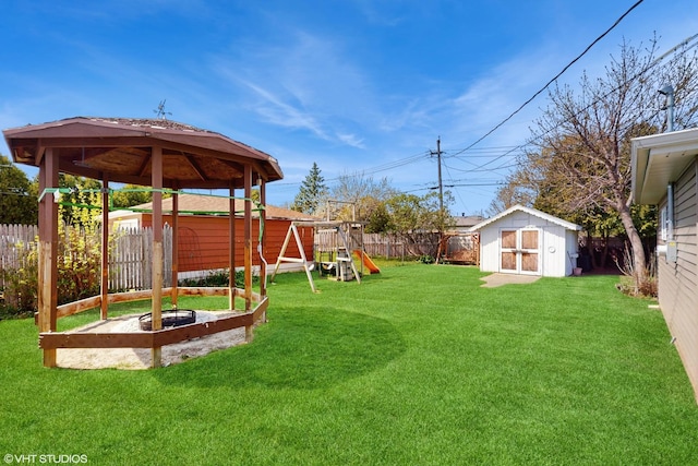 2818 Brentwood Dr, Racine, WI 53403 - view of yard with a storage unit, a playground, a gazebo, and an outbuilding