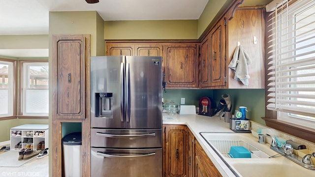2818 Brentwood Dr, Racine, WI 53403 - kitchen with stainless steel refrigerator with ice dispenser, healthy amount of natural light, a sink, and light countertops