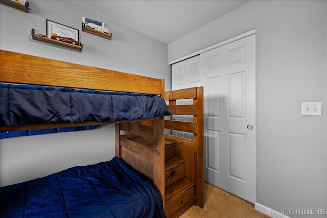 carpeted bedroom featuring a closet