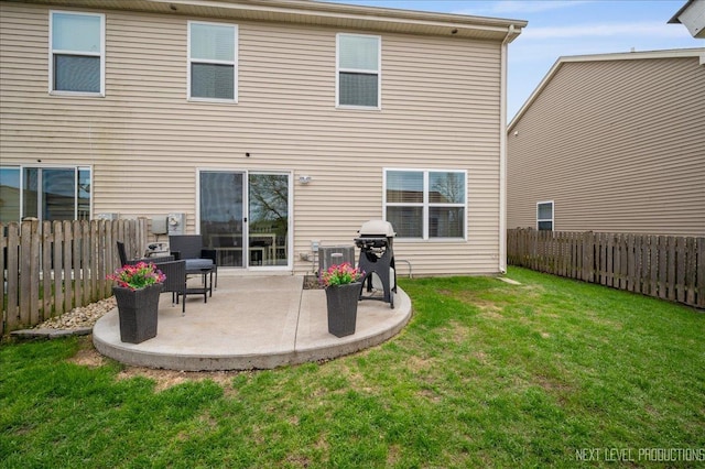 back of property with a patio