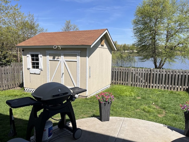 view of shed with a water view