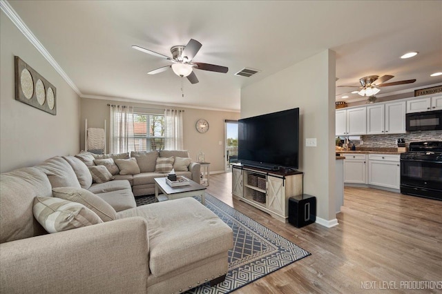 living room with ceiling fan, light wood-style floors, ornamental molding, recessed lighting, and baseboards