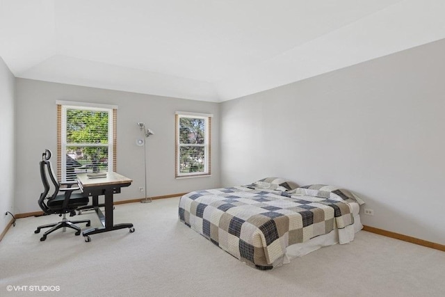 bedroom with carpet flooring, baseboards, and an office area