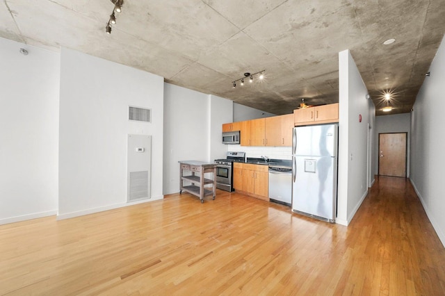 1720 S Michigan Ave Unit 2113, Chicago, IL 60616 - kitchen with stainless steel appliances, light wood finished floors, track lighting, and light brown cabinetry