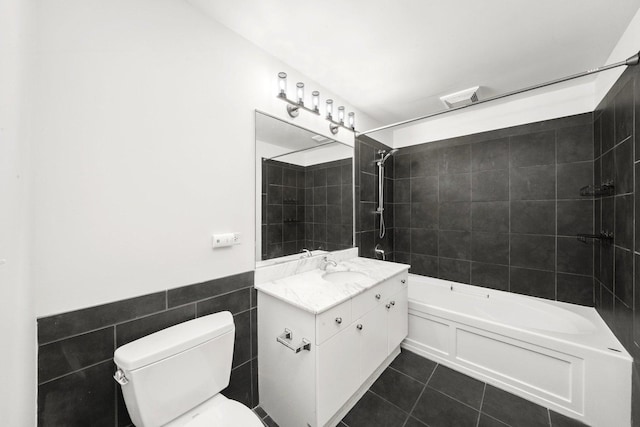1720 S Michigan Ave Unit 2113, Chicago, IL 60616 - full bath featuring tile walls, vanity, shower / tub combination, tile patterned floors, and wainscoting