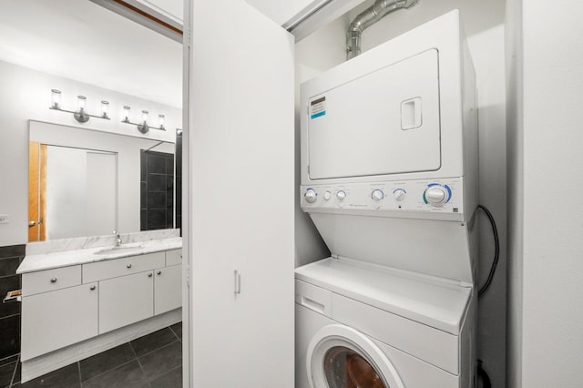 1720 S Michigan Ave Unit 2113, Chicago, IL 60616 - laundry room featuring stacked washer and clothes dryer and dark tile patterned flooring