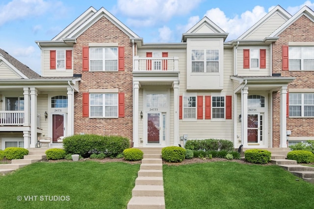 24733 Patriot Square Dr S, Plainfield, IL 60544 - townhome / multi-family property with a front lawn and brick siding