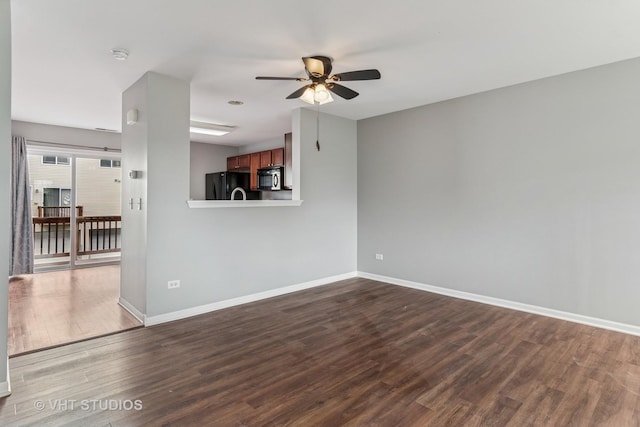 24733 Patriot Square Dr S, Plainfield, IL 60544 - unfurnished living room with a ceiling fan, dark wood-style flooring, and baseboards