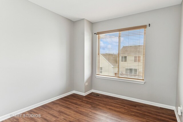 24733 Patriot Square Dr S, Plainfield, IL 60544 - empty room featuring dark wood finished floors and baseboards