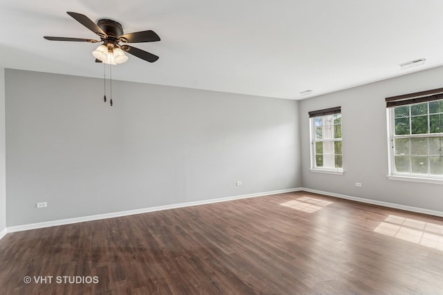 24733 Patriot Square Dr S, Plainfield, IL 60544 - unfurnished room with baseboards, wood finished floors, and a ceiling fan