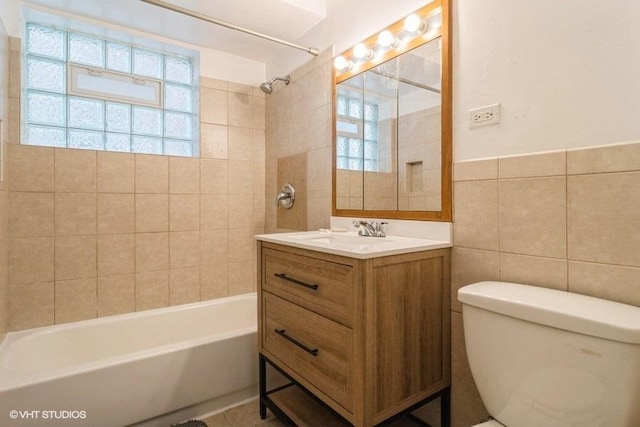 2642 N Harlem Ave Unit Gw, Elmwood Park, IL 60707 - bathroom featuring healthy amount of natural light, tile walls, toilet, vanity, and shower / tub combination