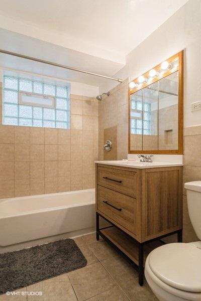 2642 N Harlem Ave Unit Gw, Elmwood Park, IL 60707 - bathroom featuring toilet, tile patterned floors, vanity, and bathtub / shower combination