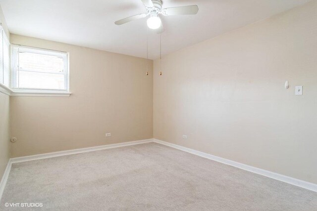 2642 N Harlem Ave Unit Gw, Elmwood Park, IL 60707 - empty room with ceiling fan, carpet, and baseboards