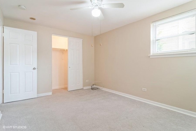 2642 N Harlem Ave Unit Gw, Elmwood Park, IL 60707 - unfurnished bedroom with light colored carpet, baseboards, a closet, and a ceiling fan